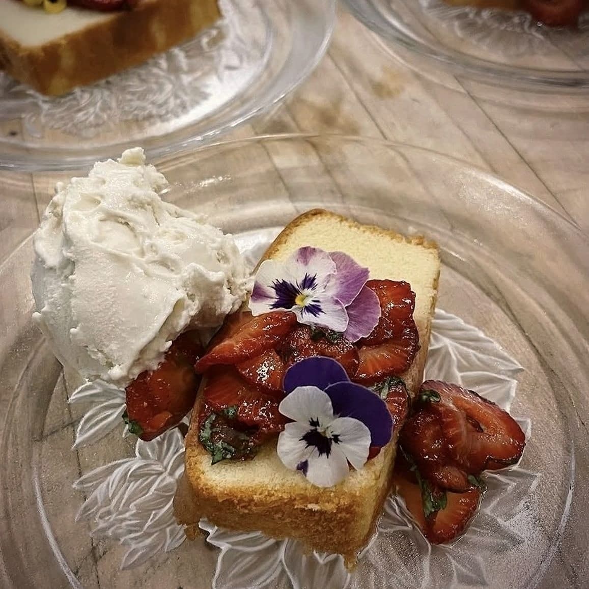 Chef Lauren Lawless's pound cake with macerated strawberries, cream and edible pansies